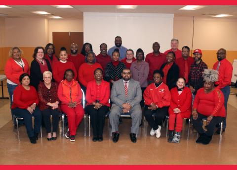 Director Robert Davis and Interim Commissioner Joy Perry join employees in support of the annual Go Red campaign.